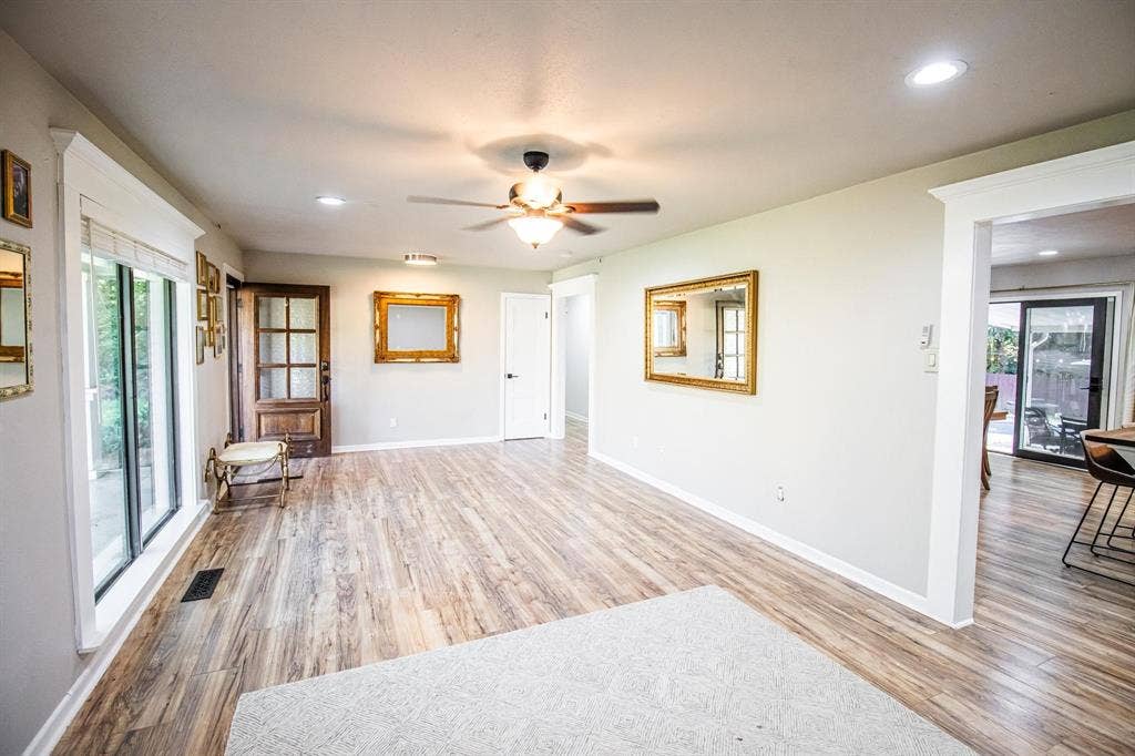 1040 Wedgewood Drive, Woodway, TX 76712 Interior space featuring wood-finish flooring, recessed lighting, a multi-blade ceiling fan, and multi-pane glass-panel door