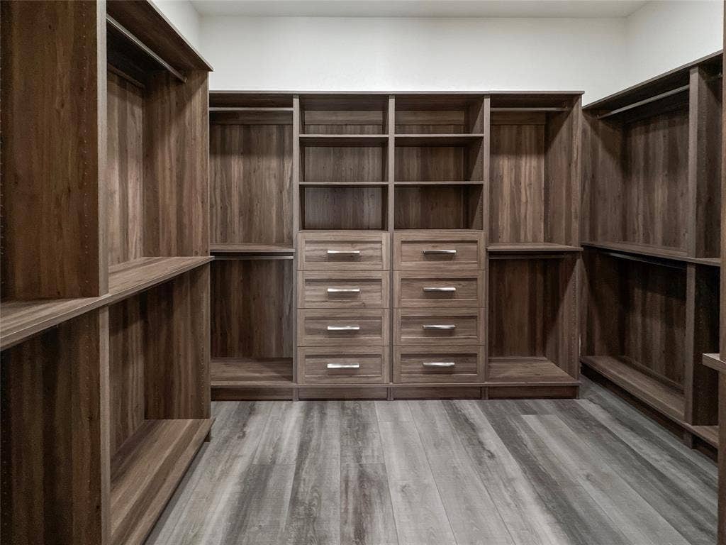 Spacious closet featuring wood-type flooring