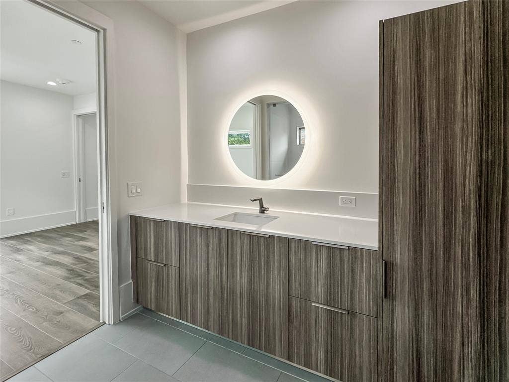 Bathroom featuring vanity and hardwood / wood-style floors