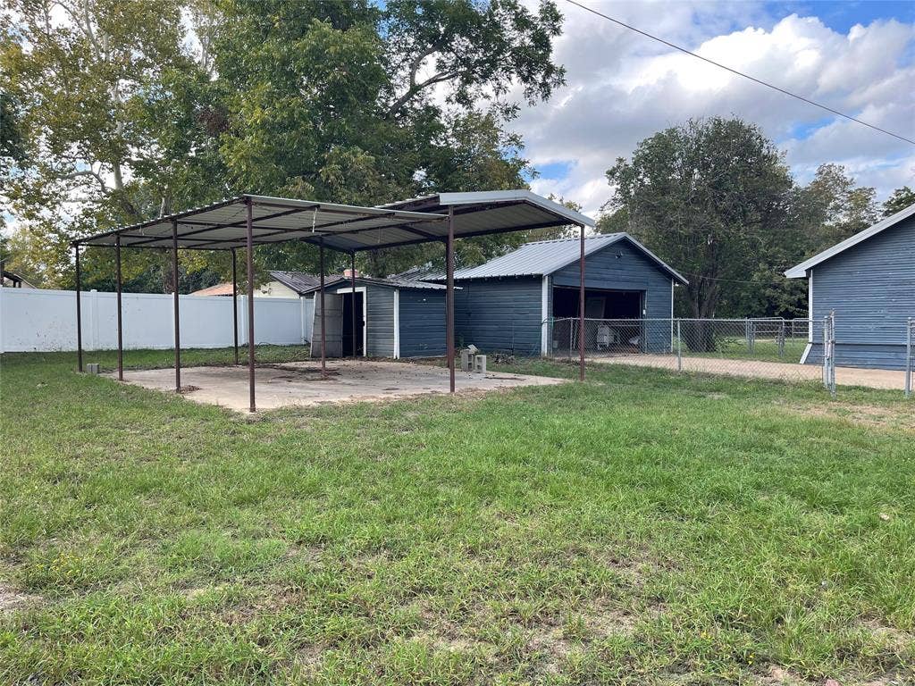 Carport & RV Carport within Fenced Backyard