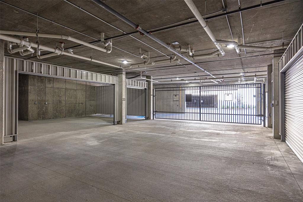 320 N O Connor Ridge Boulevard, #21, Irving, TX 75038 The private, oversized garage is unique and offers space for 3-cars AND the golf cart