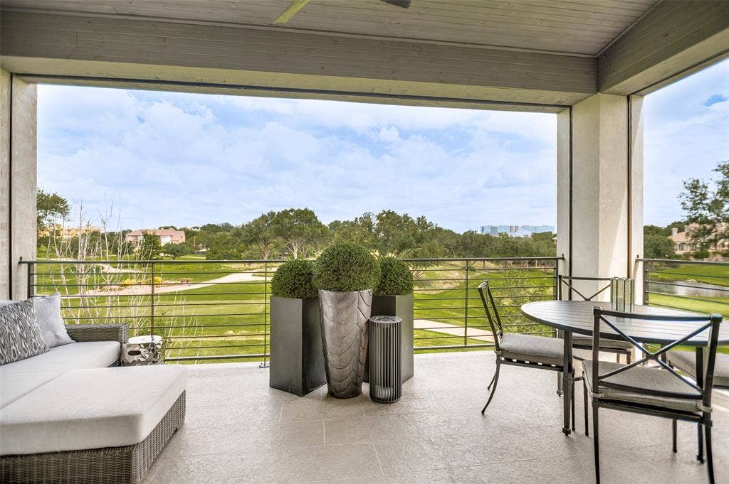 320 N O Connor Ridge Boulevard, #21, Irving, TX 75038 Relax on the private terrace where electric shades provide comfort and year-round enjoyment