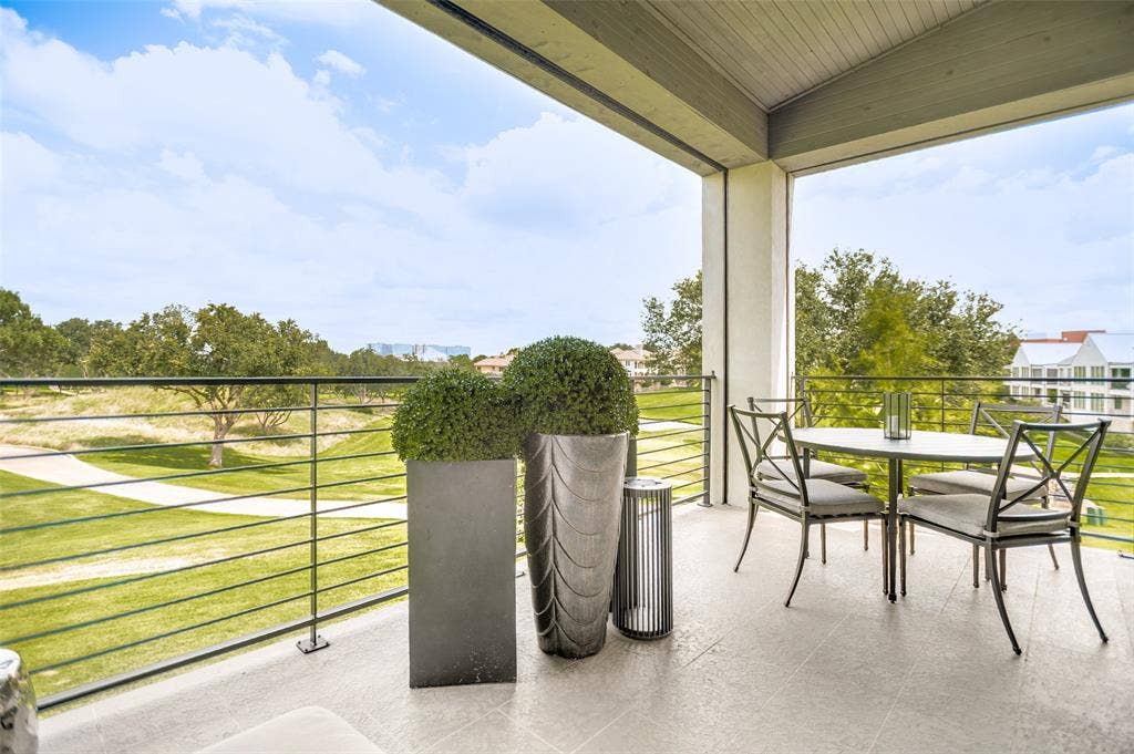 320 N O Connor Ridge Boulevard, #21, Irving, TX 75038 Overlooking the picturesque 17th fairway and serene pond