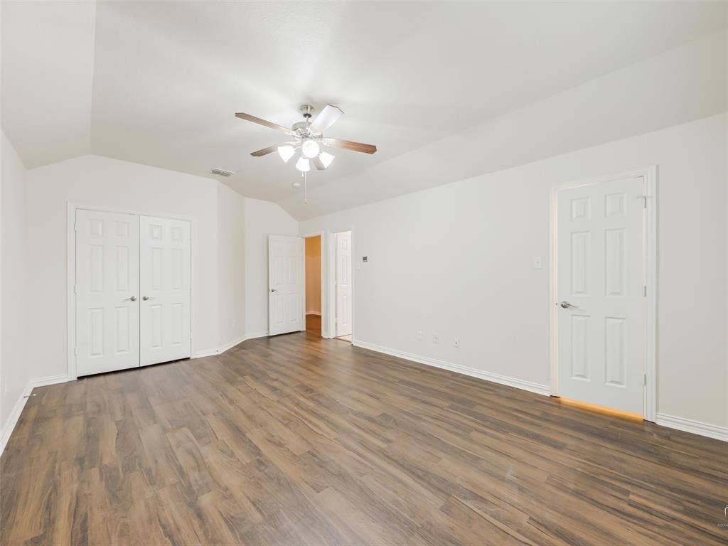 Another view of the primary bedroom with 2 closets