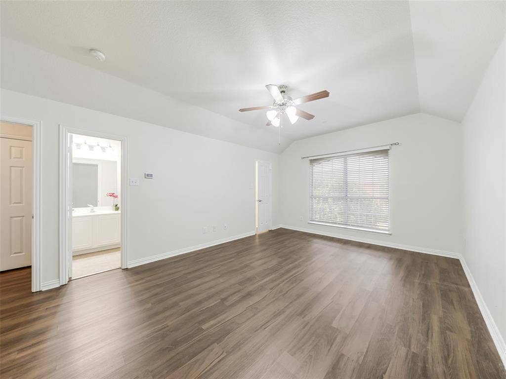 Another view of the primary bedroom with 2 closets