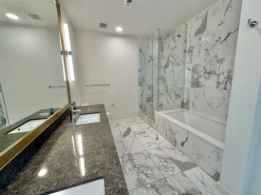 6911 Cowboys Way, #913, Frisco, TX 75034 Full bathroom with vanity, shower with separate bathtub, and toilet