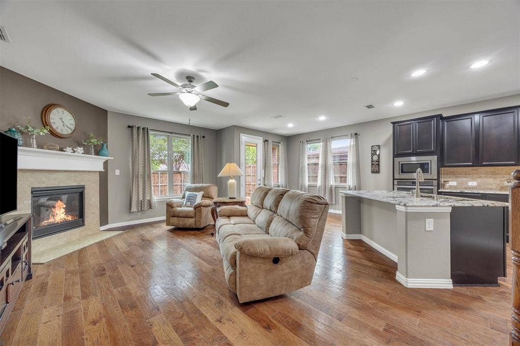 3014 Aurora Mist Drive, Little Elm, TX 75068 Central living area with open views to the kitchen and back yard.