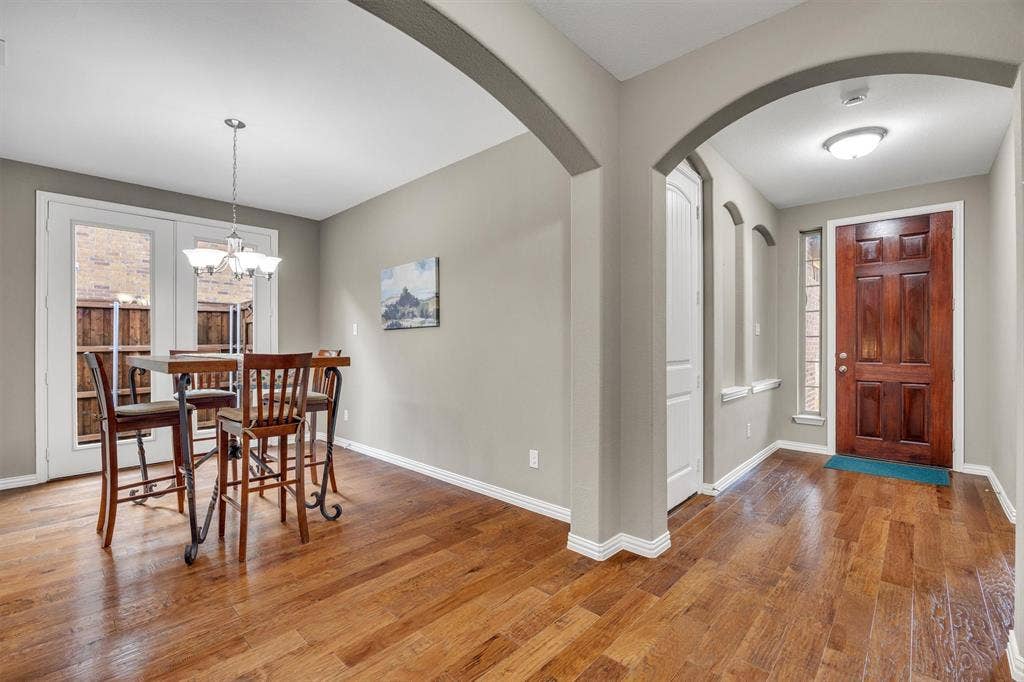 3014 Aurora Mist Drive, Little Elm, TX 75068 Engineered hardwood floors flow from the front door through the dining and main living areas.