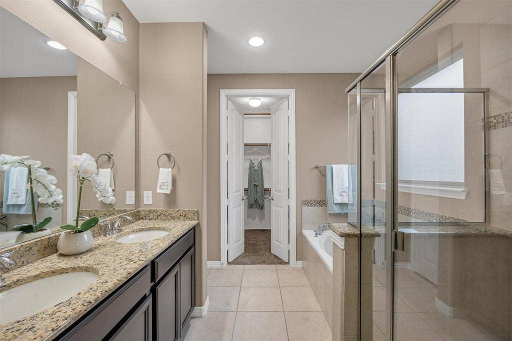 3014 Aurora Mist Drive, Little Elm, TX 75068 Pub-height dual sinks, a 4-ft shower stall and deep soaking tub.