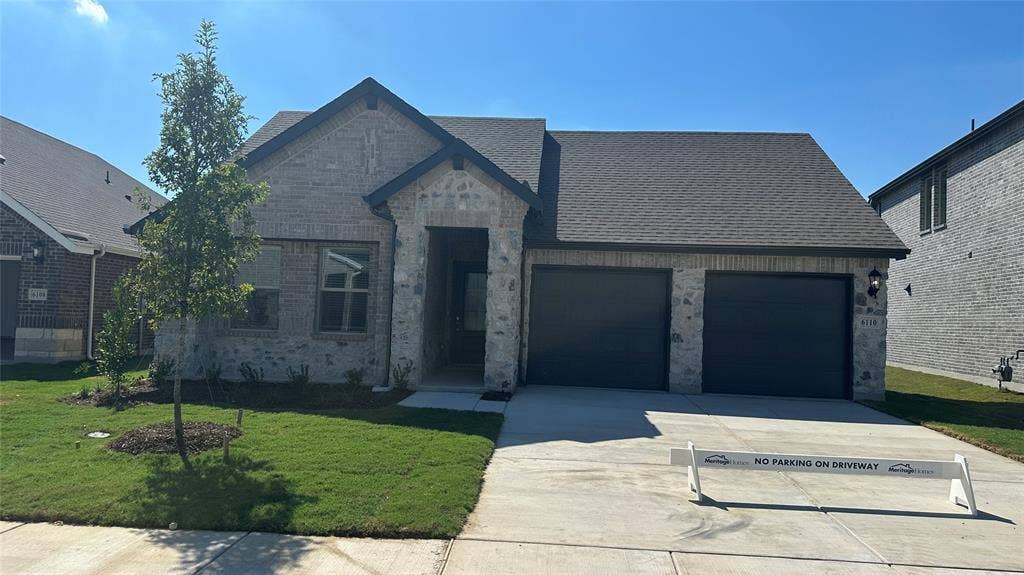 6110 CHICKNEY Drive, Princeton, TX 75071 Single-story residence featuring a mixed-material masonry facade, covered entryway, two-car garage, and concrete driveway