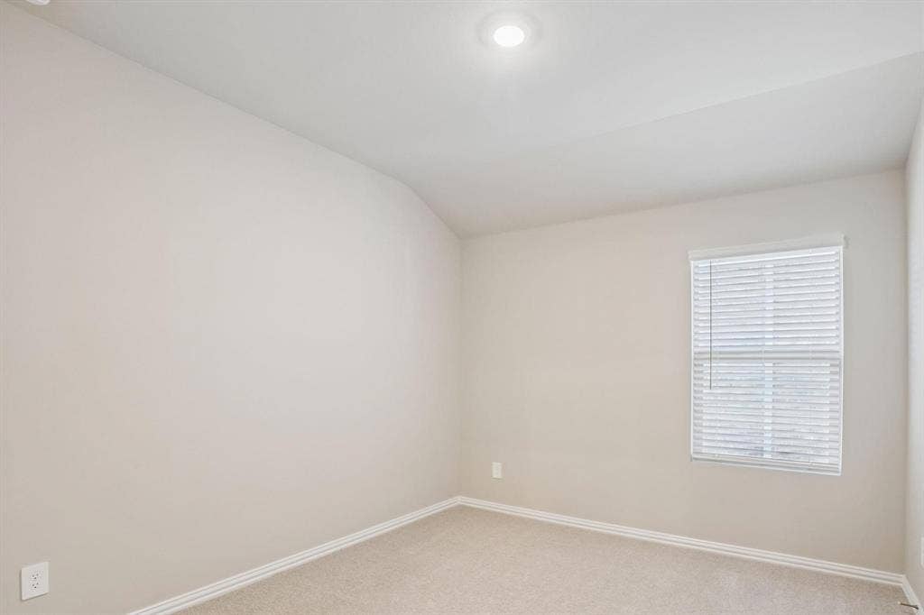 6110 CHICKNEY Drive, Princeton, TX 75071 Neutral-toned room featuring a vaulted ceiling, recessed lighting, wall-to-wall carpeting, and a window with horizontal blinds