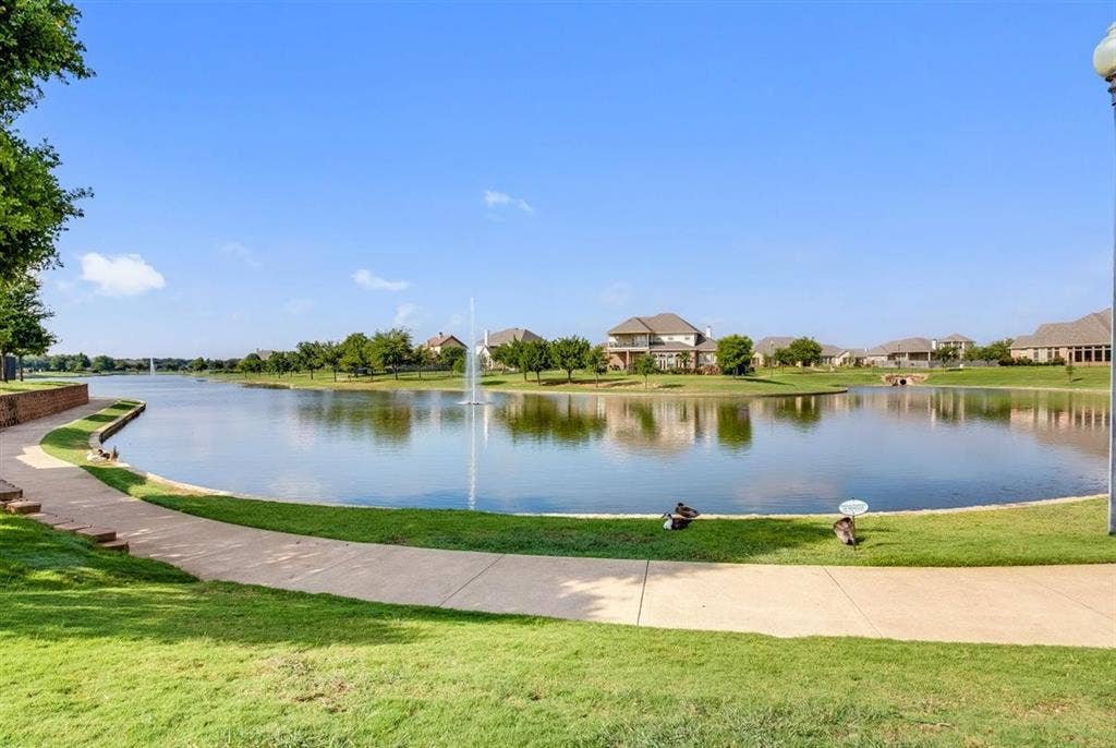 329 Edinburgh Lane, Waco, TX 76712 View of community lake with walking path