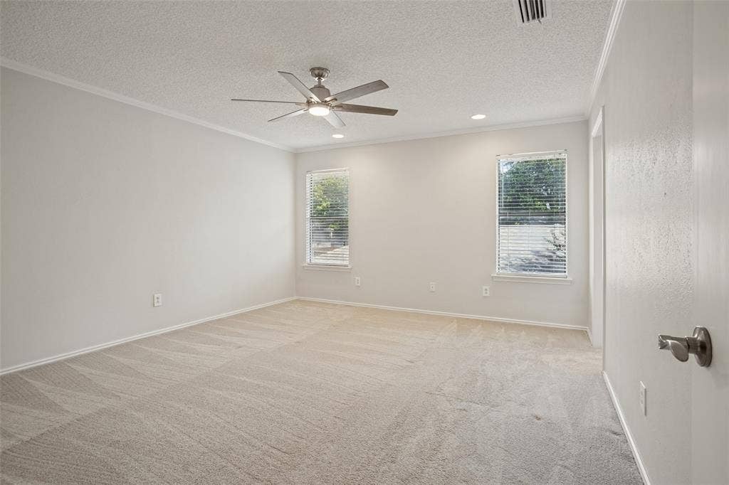 Primary bedroom with ensuite bath and two walk-in closets.