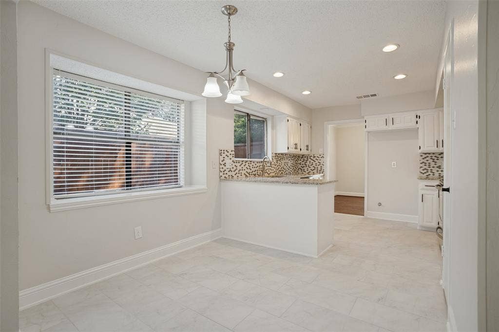 Breakfast area and kitchen, new porcelain tile floors.