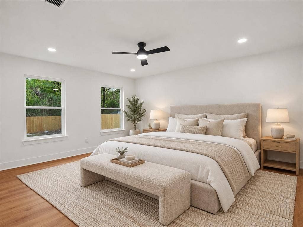 9059 Quinn Street, Dallas, TX 75217 Spacious room featuring wood-finish flooring, recessed lighting, a matte black ceiling fan, and dual pane windows