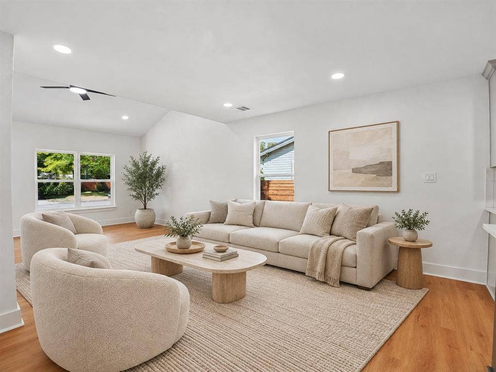 9059 Quinn Street, Dallas, TX 75217 Vaulted ceilings featuring recessed lighting and a central ceiling fan, paired with wood-finish flooring and multiple windows