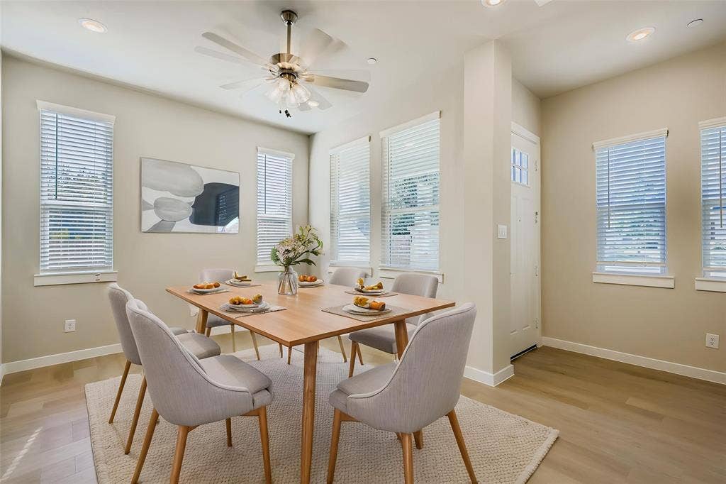 1204 Pebblebrook Drive, McKinney, TX 75071 Neutral-toned room featuring wood-finish flooring, recessed lighting, a modern ceiling fan, and multiple windows with horizontal blinds