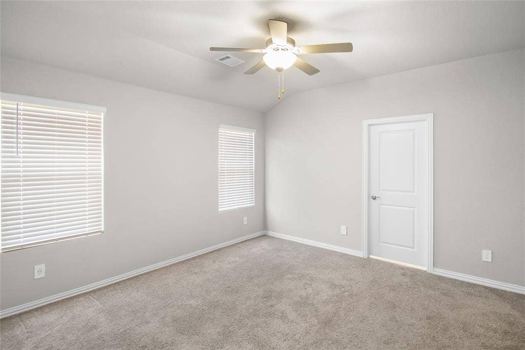 614 Martell Road, Lowry Crossing, TX 75069 Vaulted ceilings featuring a centrally mounted ceiling fan with integrated lighting, neutral wall-to-wall carpeting, and two windows equipped with horizontal blinds