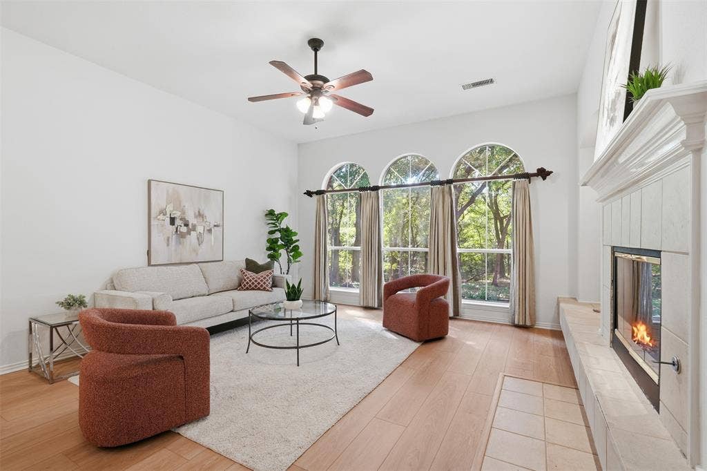 2902 Glen Hollow Court, McKinney, TX 75072 Family room offers ample lighting and architectural interest with arched windows.