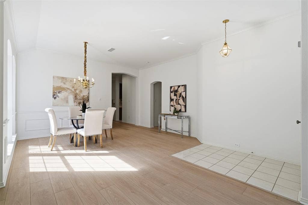 2902 Glen Hollow Court, McKinney, TX 75072 Open-concept formal dining room offers space for family gatherings or initmate dinners.