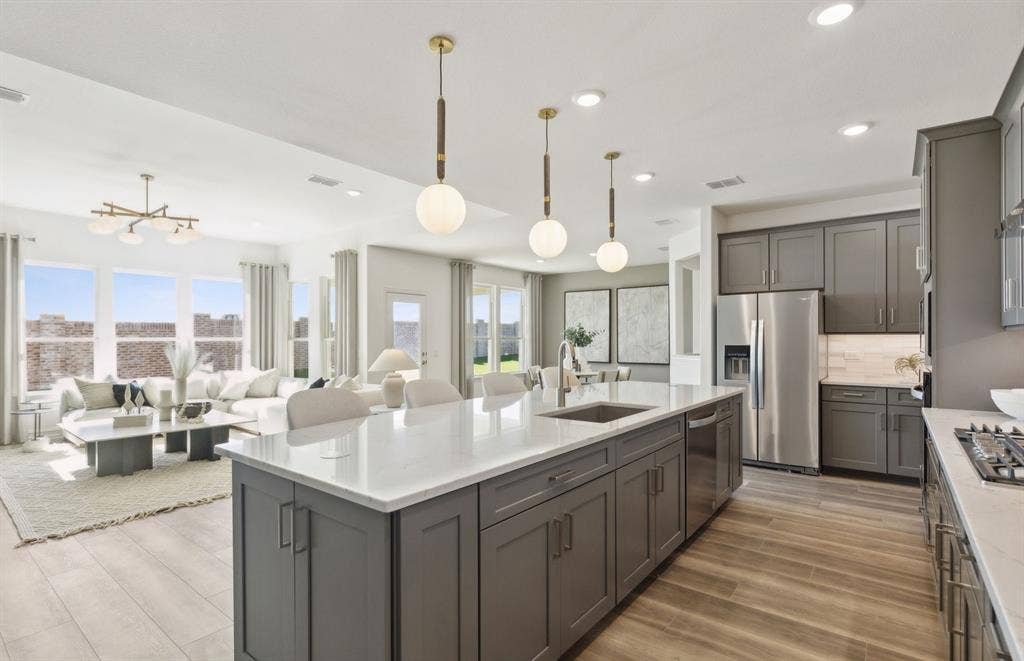 1500 Xavier Street, Anna, TX 75409 *Model Representation - Large island gathering room and dining areas overlooking