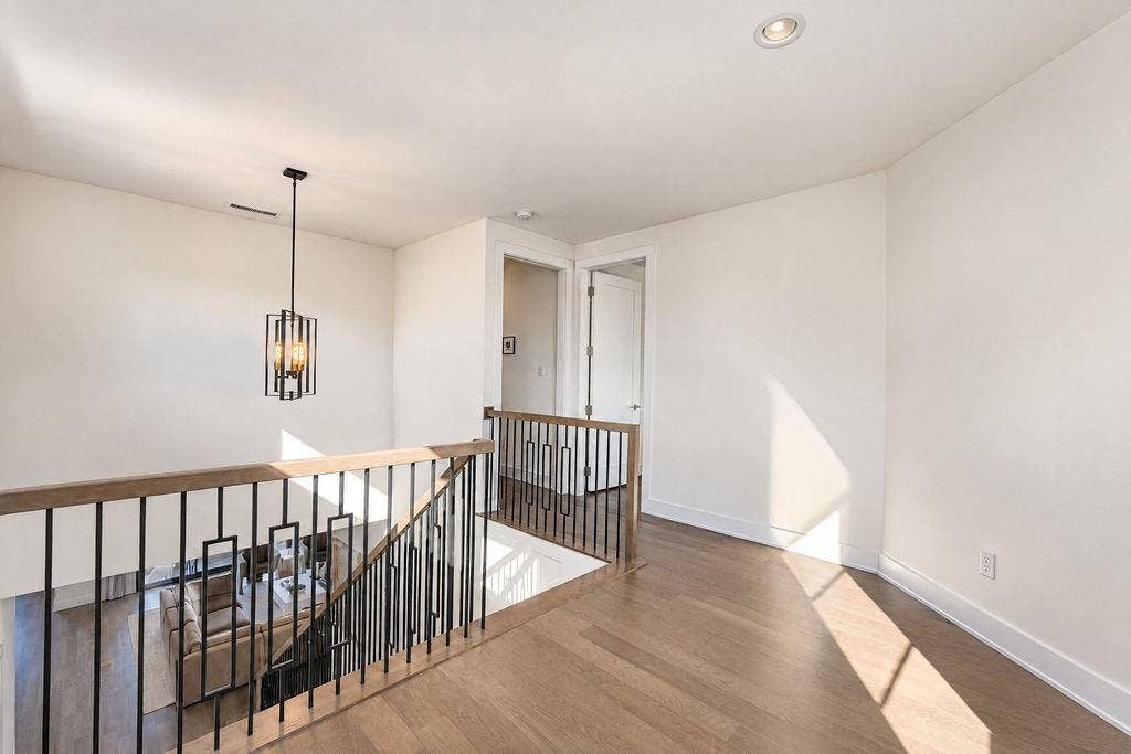 4515 Cowan Avenue, Dallas, TX 75209 The top of the stairs opens into a wide hallway, keeping the upper level feeling open and easy to navigate