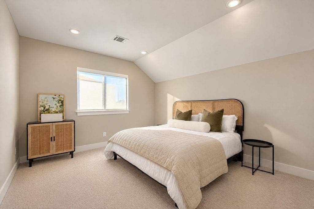 4515 Cowan Avenue, Dallas, TX 75209 With a vaulted ceiling and a spacious layout, this guest bedroom easily accommodates full bedroom furniture while leaving plenty of room to stretch out