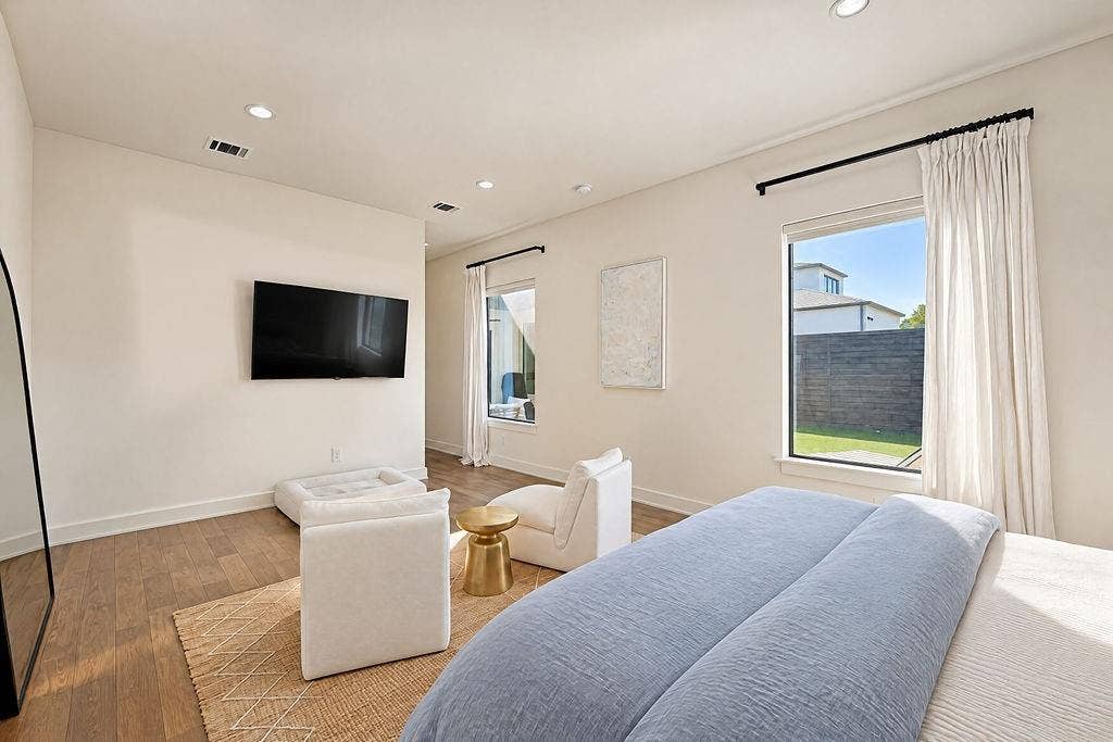 4515 Cowan Avenue, Dallas, TX 75209 Enjoy restful nights and bright mornings in a primary suite positioned quietly at the back of the home