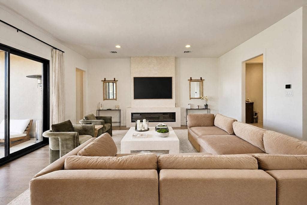 4515 Cowan Avenue, Dallas, TX 75209 Unwind in a light-filled living space with an electric fireplace built into the feature wall for cozy evening relaxation