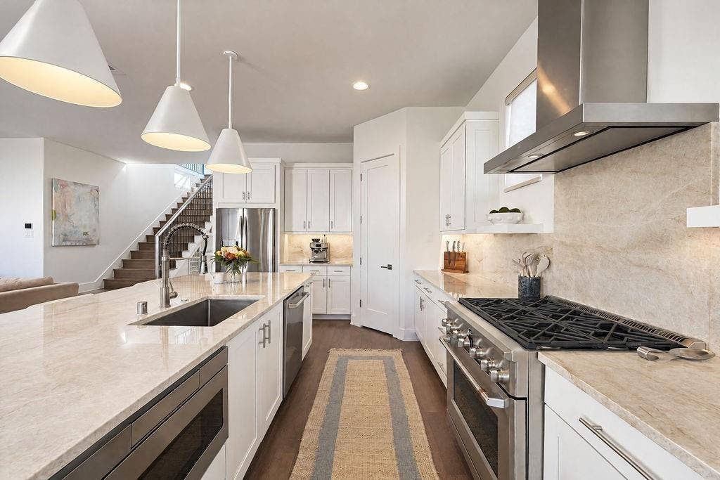 4515 Cowan Avenue, Dallas, TX 75209 Stainless appliances, gas cooking, and a built-in microwave keep meal preparation streamlined and organized