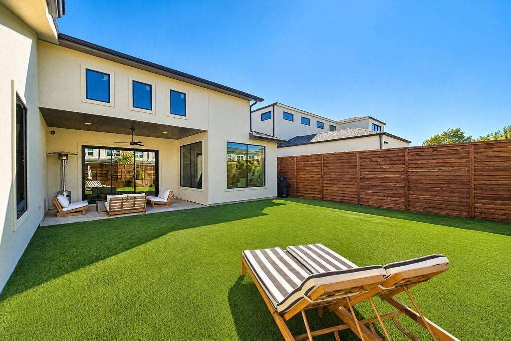 4515 Cowan Avenue, Dallas, TX 75209 Turf grass keeps the private backyard looking lush and green 365 days a year with zero lawnmowers required
