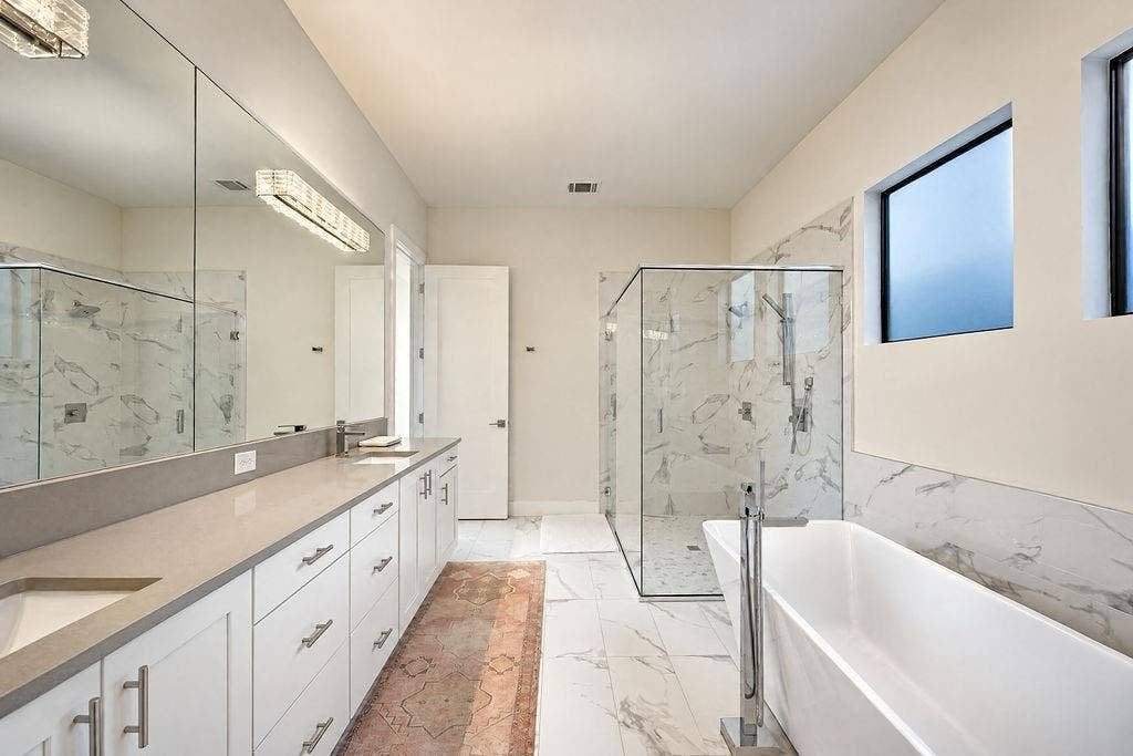 4515 Cowan Avenue, Dallas, TX 75209 A long dual vanity with plenty of counter space and drawer storage keeps morning routines calm and effortless