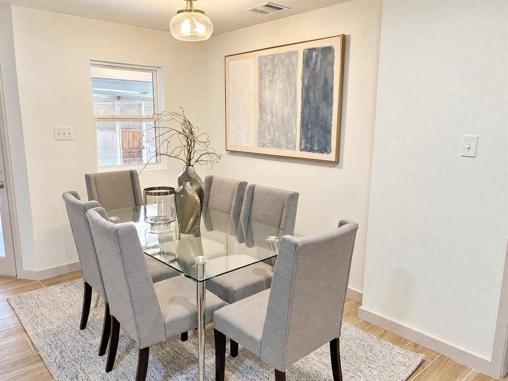 2551 Pinebluff Drive, Dallas, TX 75228 Dining space featuring neutral wall paint, wood-finish flooring, and a glass-shade pendant light