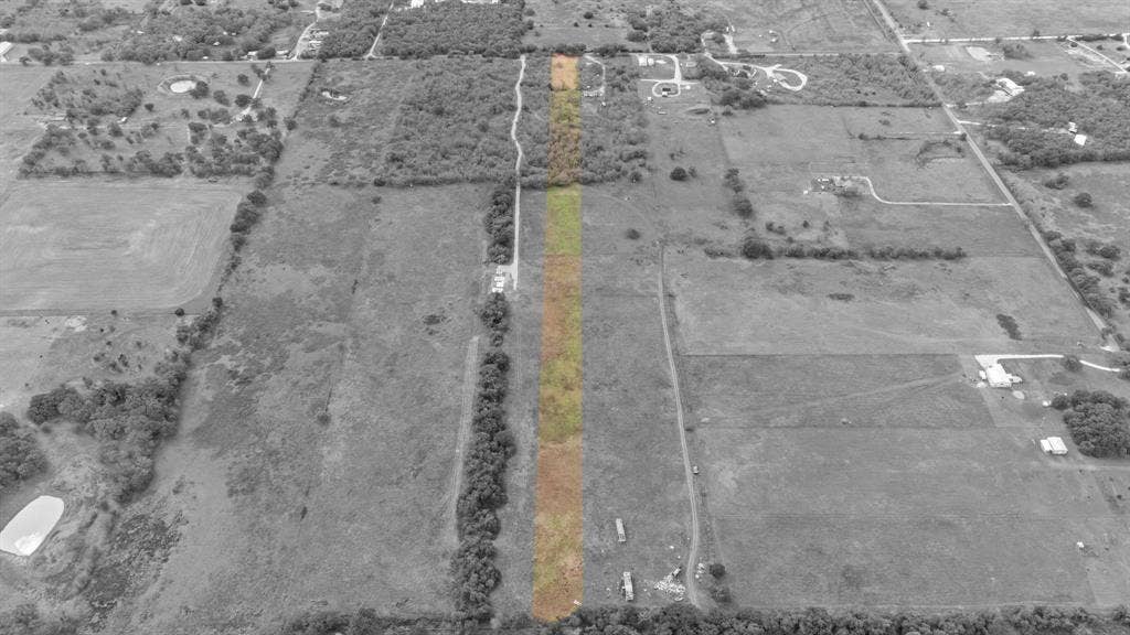 870 Wagoner Road, Waco, TX 76705 Aerial perspective of a rectangular parcel featuring cleared land, native grasses, and mature perimeter trees