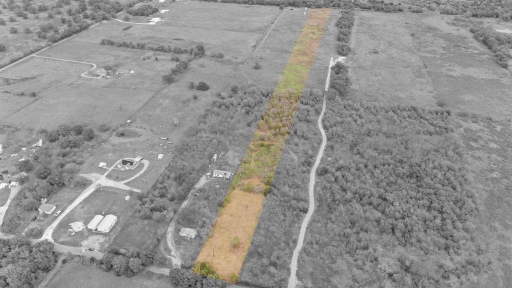 870 Wagoner Road, Waco, TX 76705 Aerial perspective of expansive acreage featuring open grasslands and clusters of mature trees