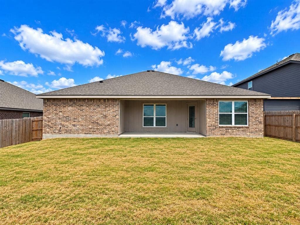 1306 Campbelton Drive, Temple, TX 76504 Rear exterior featuring brick masonry, a covered patio, dual-pane windows, and a fenced backyard