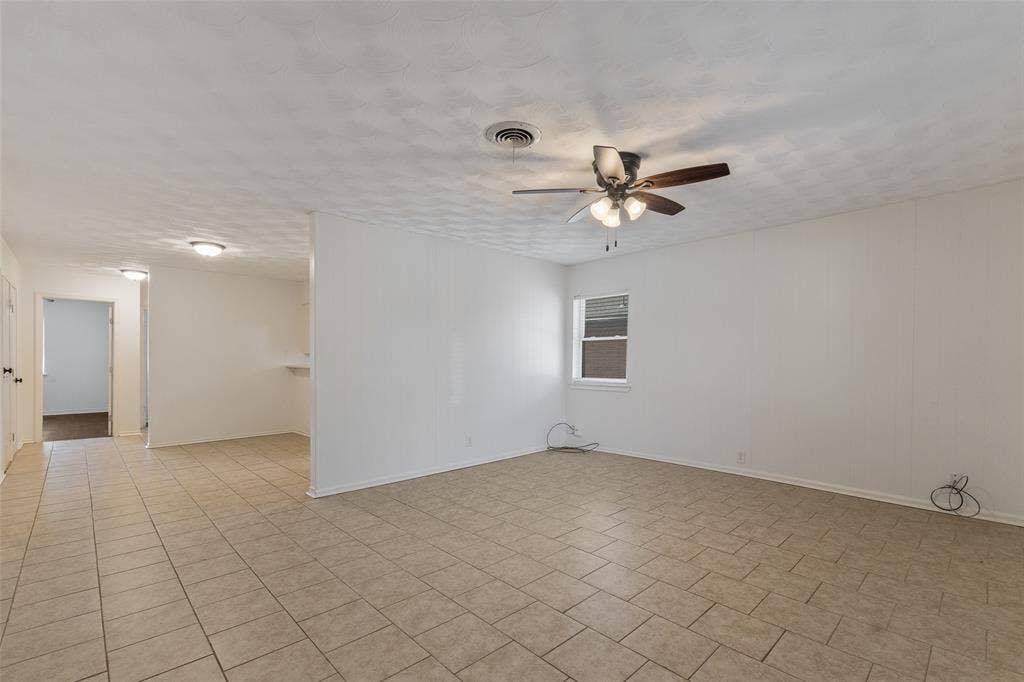 11038 Wyatt, Dallas, TX 75218 Interior space featuring tile flooring, ceiling fan with integrated lighting, and textured ceiling finish