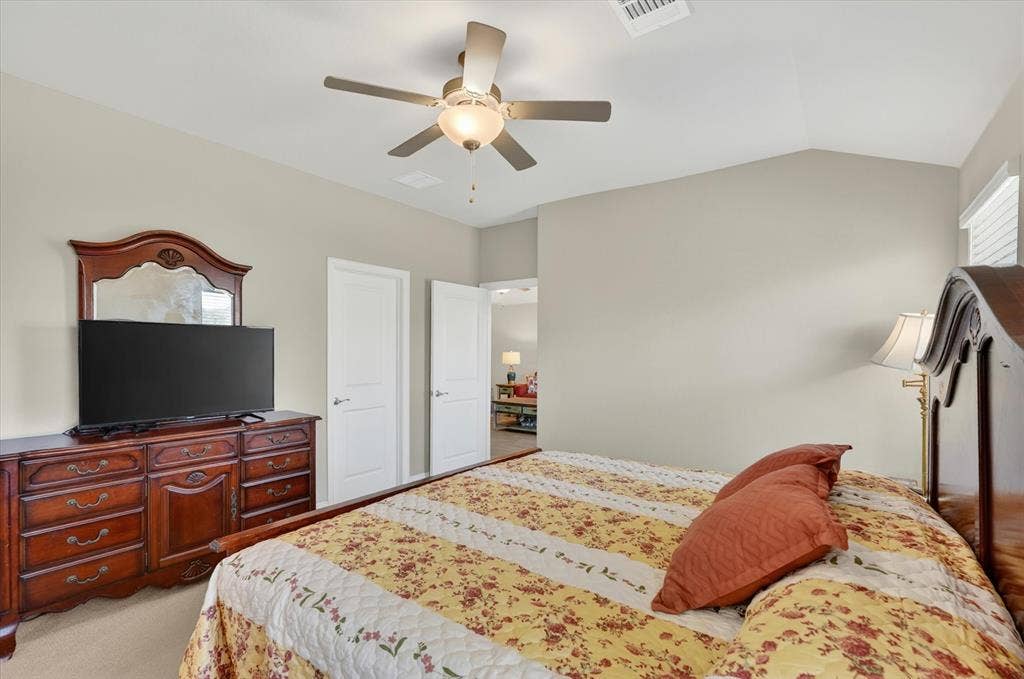 903 Edgehurst Drive, Princeton, TX 75071 Vaulted ceiling featuring a ceiling fan with integrated lighting