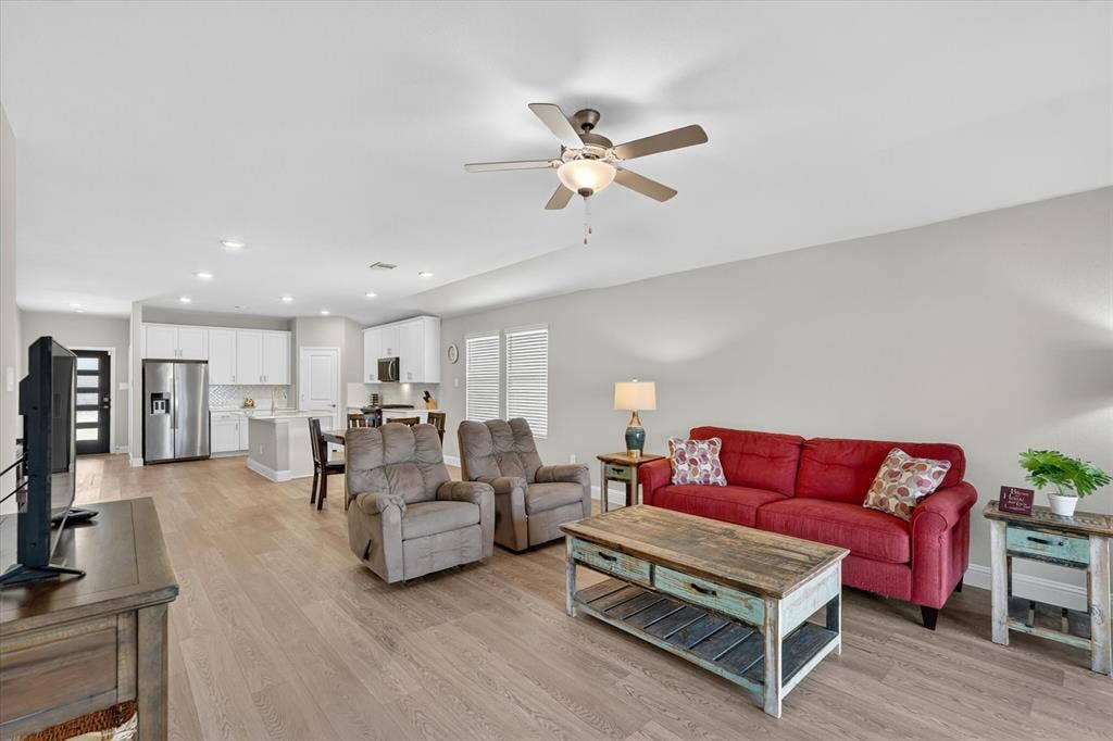 903 Edgehurst Drive, Princeton, TX 75071 Open-concept living space featuring wood-finish flooring, recessed lighting, and a ceiling fan