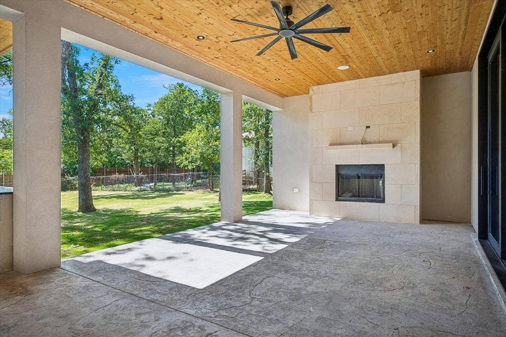 Patio off the living area has an outdoor fireplace
