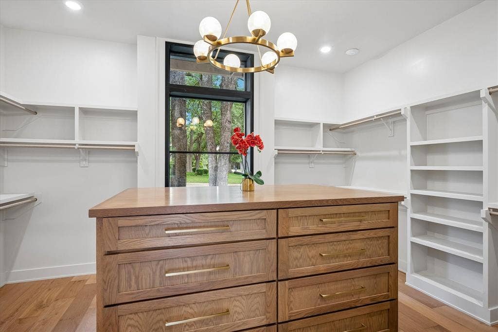Primary Bedroom Closet with oversized Built-In Chest of Drawers