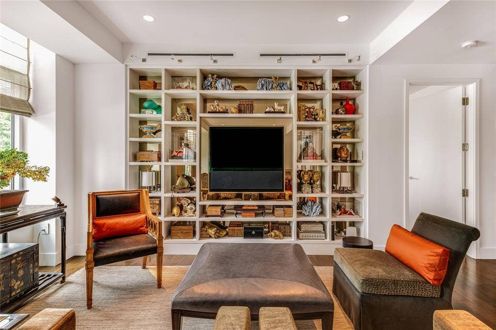 2025 Woodall Rodgers Freeway, #32, Dallas, TX 75201 Built-in TV and library shelves in the living area.