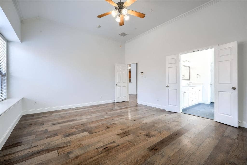 1127 Valley Vista Drive, Irving, TX 75063 Vaulted ceilings, wood-finish flooring, recessed window ledge, and multi-light ceiling fan