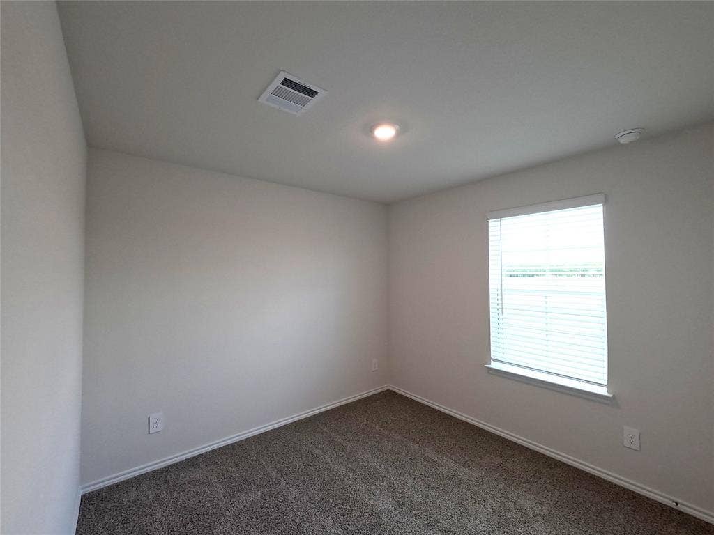 4017 Bronco Drive, Princeton, TX 75407 Neutral-toned interior room featuring wall-to-wall carpeting, a single-pane window with white horizontal blinds, and a recessed ceiling light