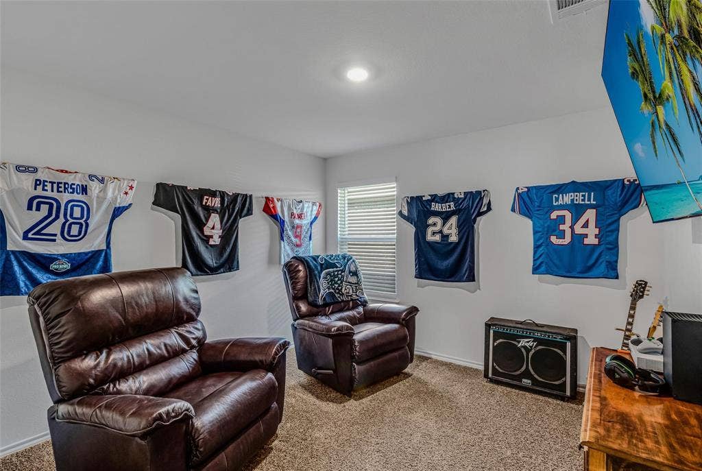 118 Secretariat Lane, Caddo Mills, TX 75135 Living area featuring carpet