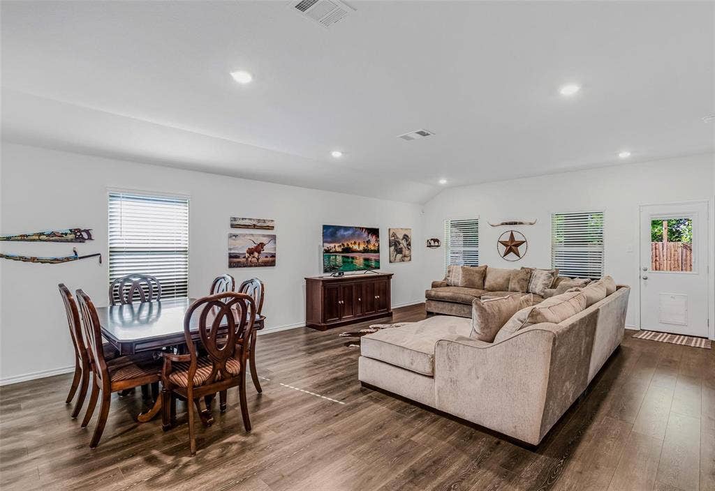 118 Secretariat Lane, Caddo Mills, TX 75135 Living room featuring vaulted ceiling and dark hardwood / wood-style flooring