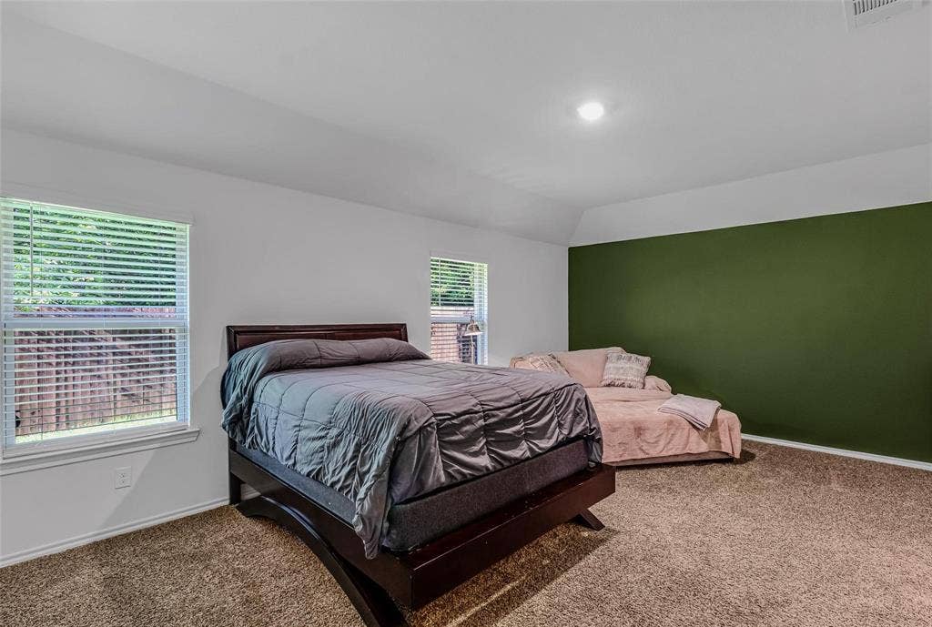 118 Secretariat Lane, Caddo Mills, TX 75135 Bedroom with carpet flooring and vaulted ceiling