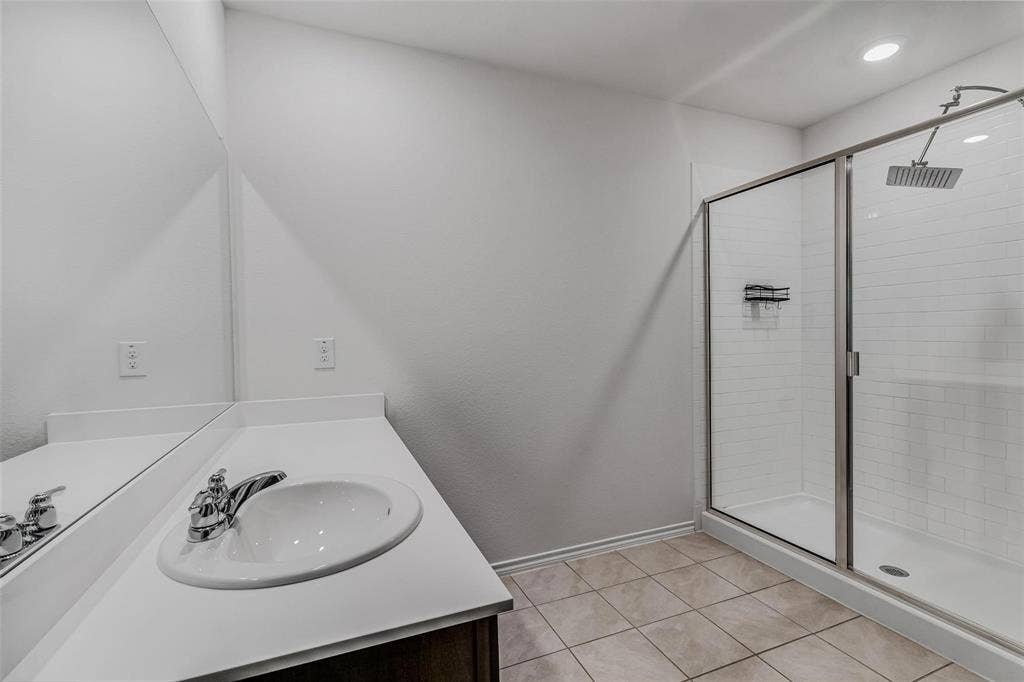 118 Secretariat Lane, Caddo Mills, TX 75135 Bathroom featuring vanity, an enclosed shower, and tile patterned floors