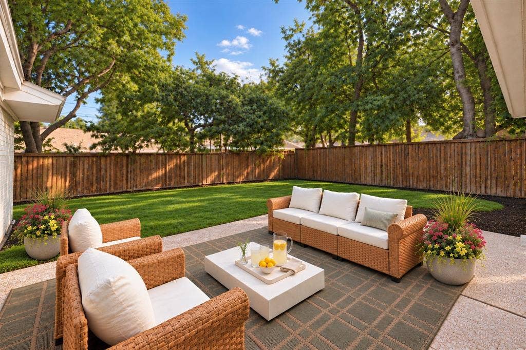 Enjoy this private backyard, offering a wonderful setting for outdoor relaxation and entertaining. (This photo has been digitally enhanced.)