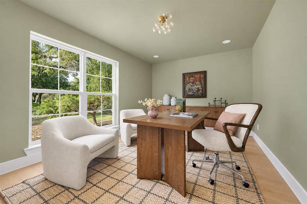 This beautifully appointed home office provides an ideal setting for working from home. It can also be used as another bedroom. (This photo has been digitally enhanced.)